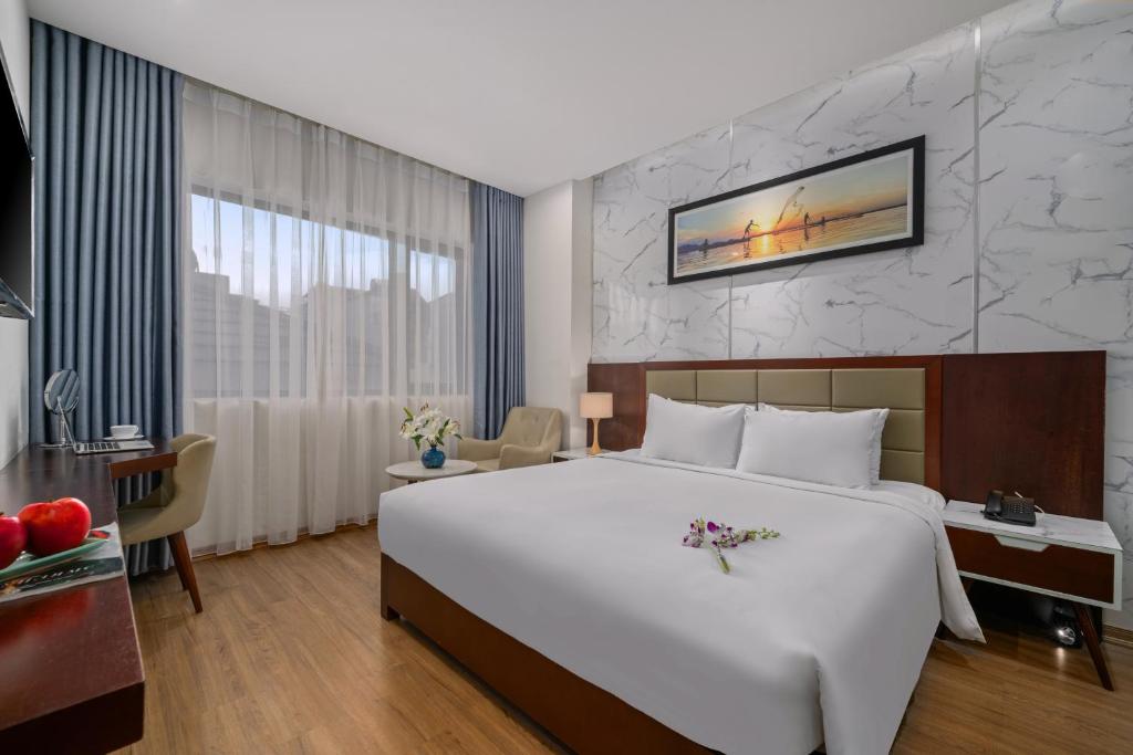 Postel nebo postele na pokoji v ubytování Aria Grand Hotel & Spa