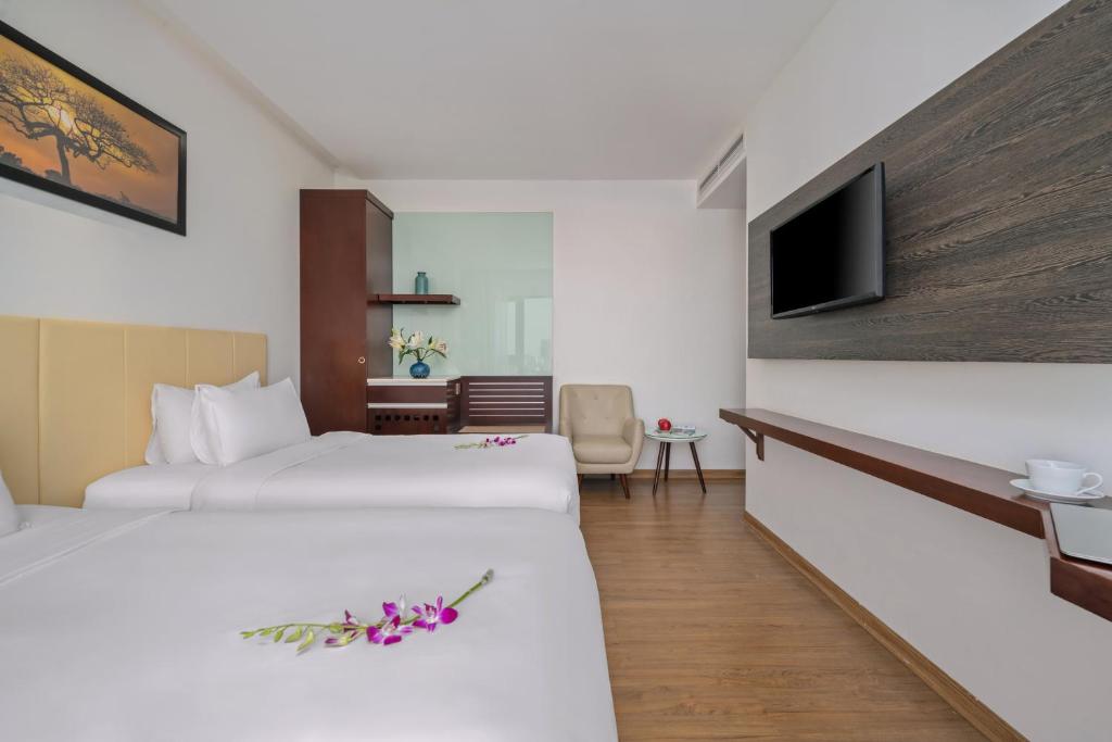 Postel nebo postele na pokoji v ubytování Aria Grand Hotel & Spa