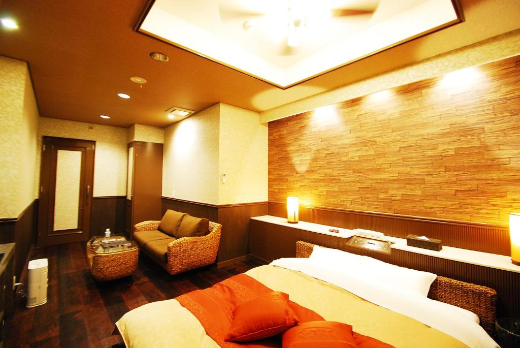 Postel nebo postele na pokoji v ubytování Hotel Free Style Okayama
