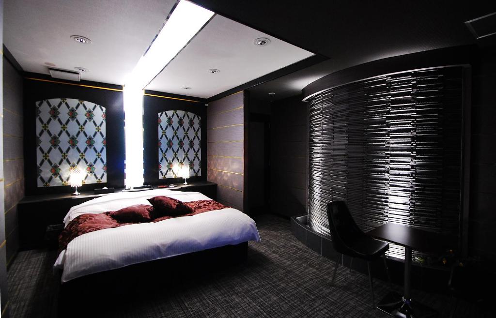 Postel nebo postele na pokoji v ubytování Hotel Free Style Okayama