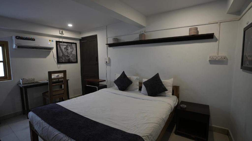 Postel nebo postele na pokoji v ubytování Anjoned Hostel & Cafe