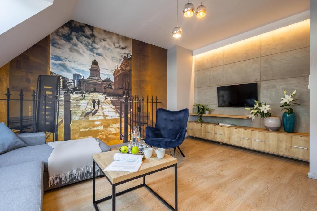 Televízia a/alebo spoločenská miestnosť v ubytovaní Apartament 24 AbsyntApart Rynek Wrocław