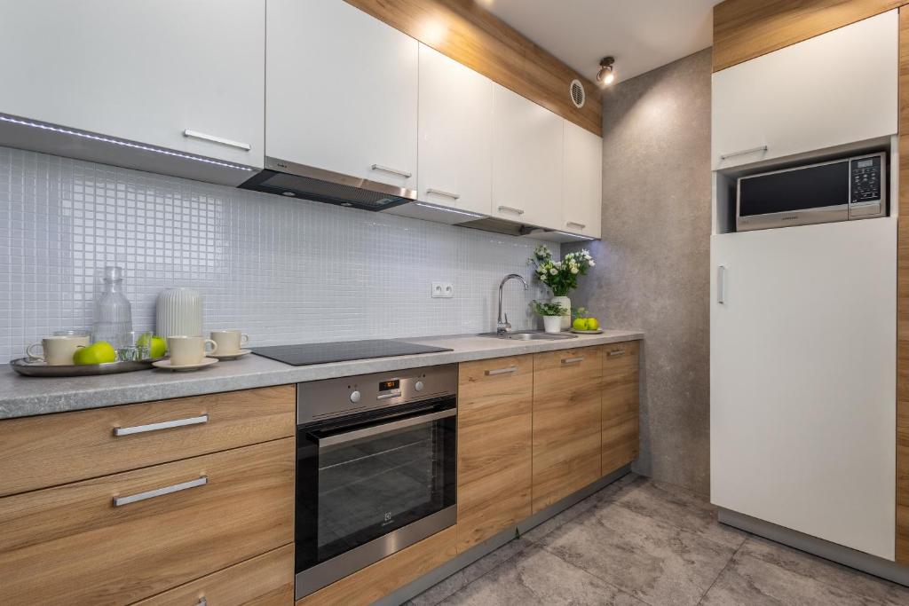 Kuchyňa alebo kuchynka v ubytovaní Apartament 24 AbsyntApart Rynek Wrocław