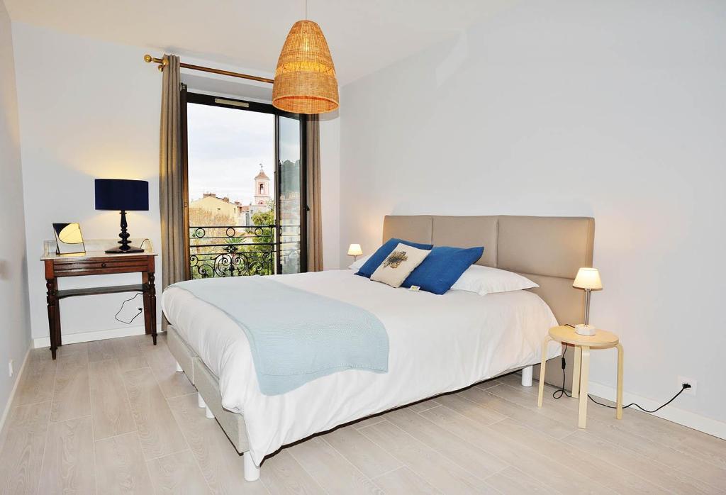 Posteľ alebo postele v izbe v ubytovaní ApartHotel Riviera - BBB G Terrasse Felix Faure 1 Massena Promenade A