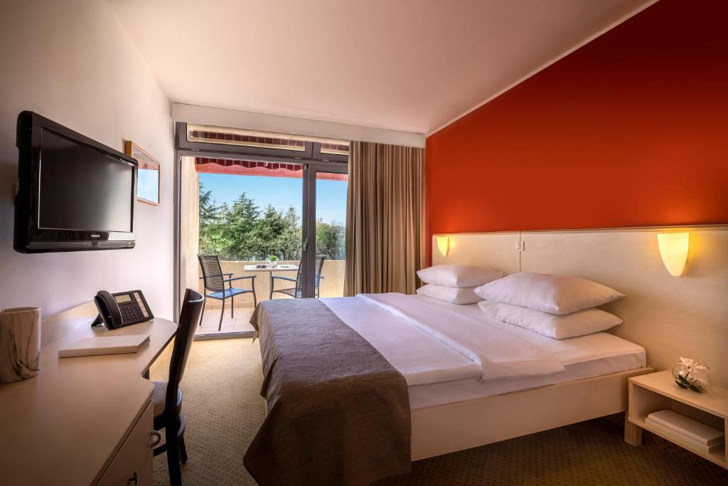 Letto o letti in una camera di Rubin Hotel