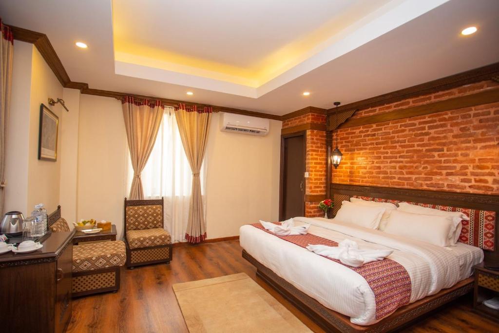 Postel nebo postele na pokoji v ubytování Pashupati Boutique Hotel & Spa