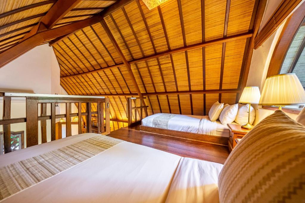 Postel nebo postele na pokoji v ubytování Klumpu Bali Resort