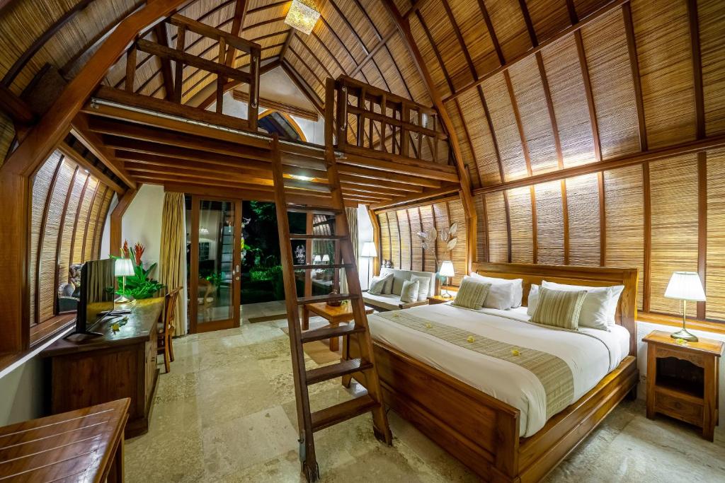Postel nebo postele na pokoji v ubytování Klumpu Bali Resort