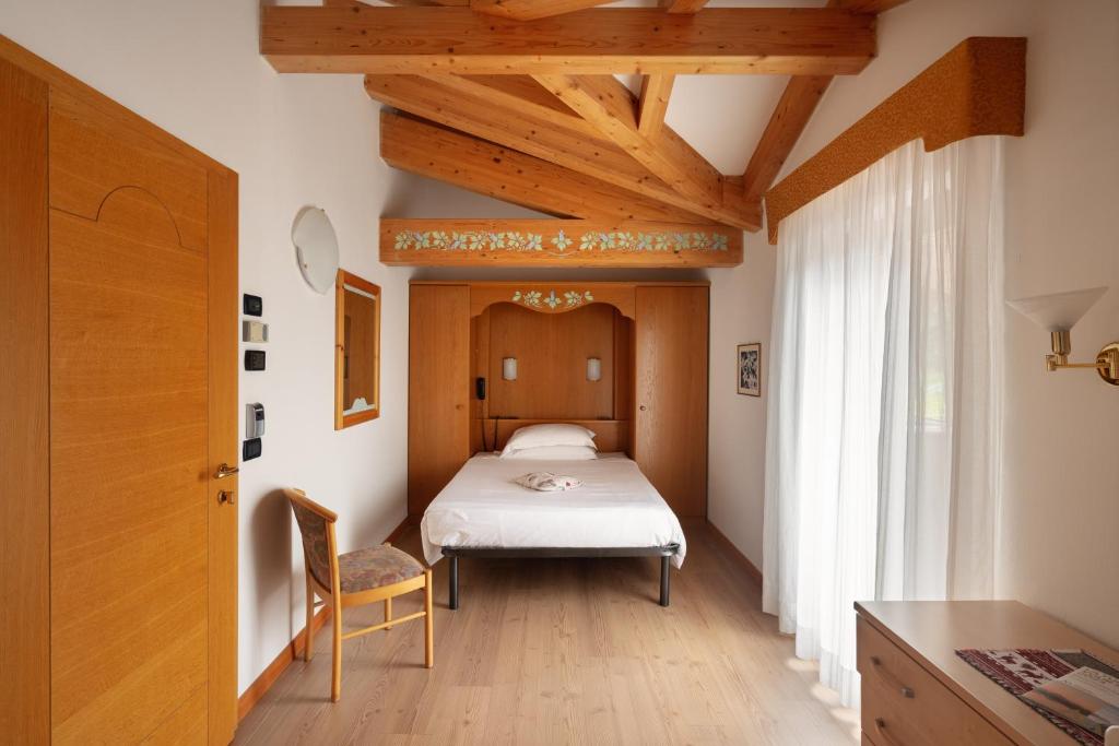 Łóżko lub łóżka w pokoju w obiekcie Hotel Villa Emma
