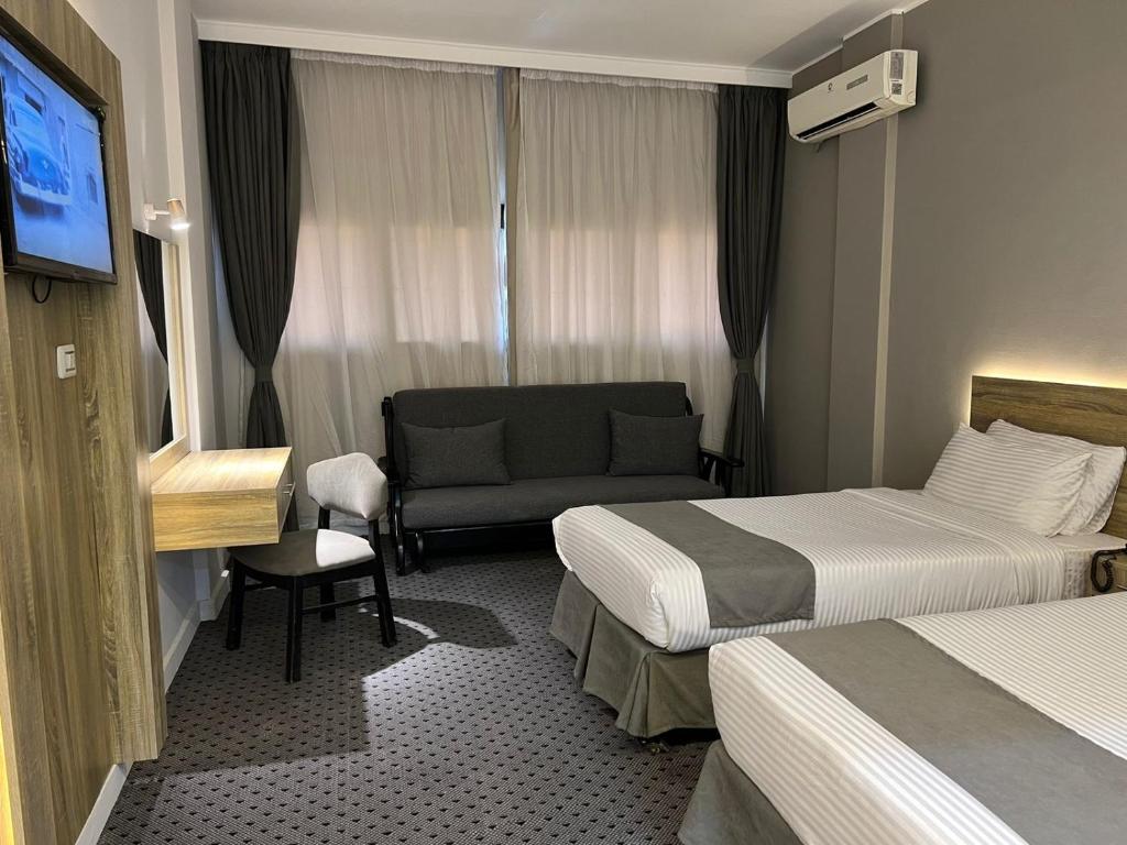 Postel nebo postele na pokoji v ubytování Atlas International Hotels