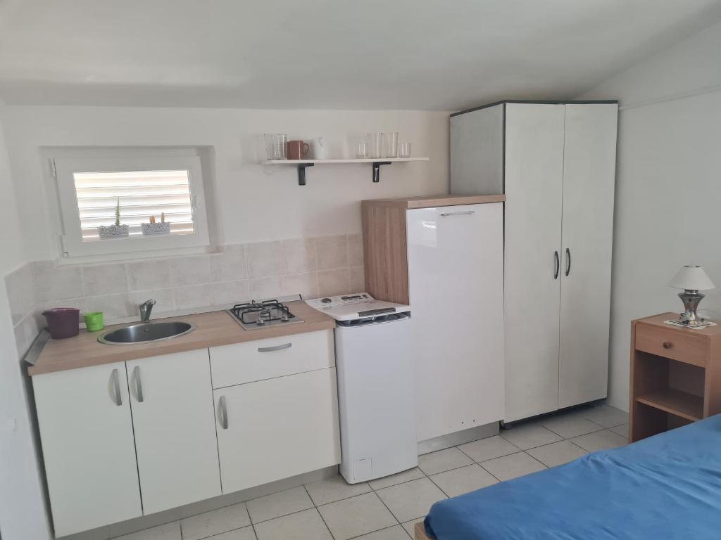 Kuchyň nebo kuchyňský kout v ubytování Apartments Ivan