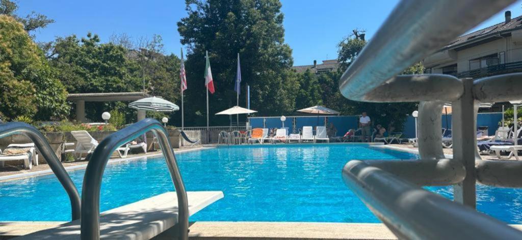 a swimming pool with a slide in a resort at Mondial Park Hotel in Fiuggi