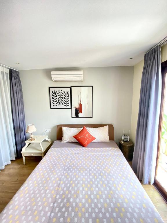 Postel nebo postele na pokoji v ubytování The Palmian City Center Serviced Apartment