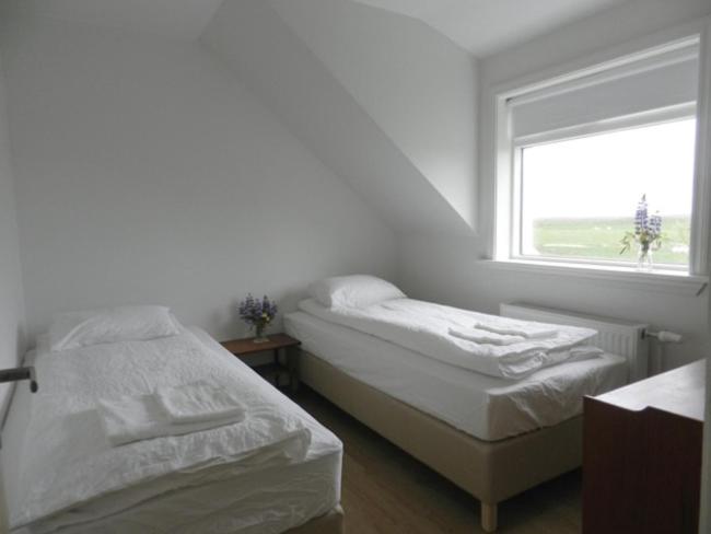 Postel nebo postele na pokoji v ubytování Farmhouse Meiri-Tunga 1