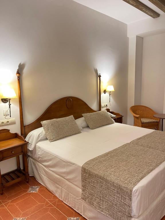 Postel nebo postele na pokoji v ubytování Hotel Rural Cazorla Posada del Cordobés