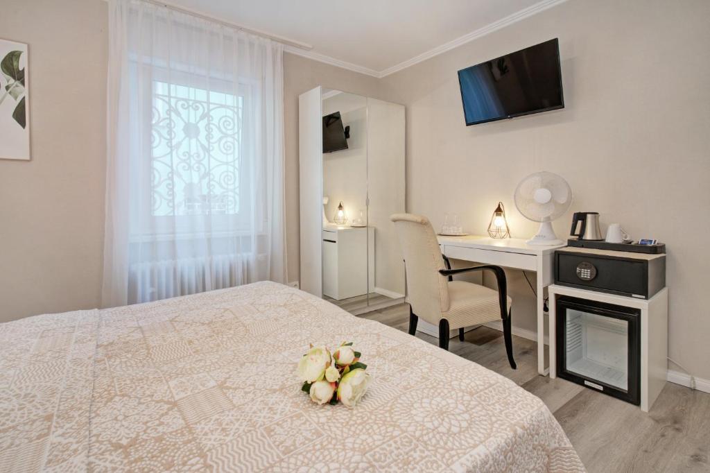 Postel nebo postele na pokoji v ubytování Hotel Löhr