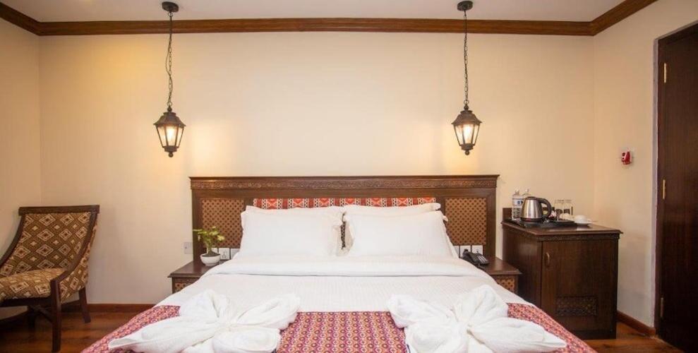 Postel nebo postele na pokoji v ubytování Pashupati Boutique Hotel & Spa
