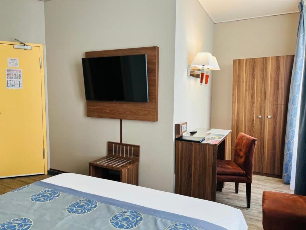 TV a/nebo společenská místnost v ubytování Hotel Capitole