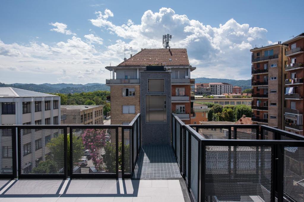 a balcony with a door on top of a building at LA CASA DI MALU Apart Hotel : Elegant Flats in Turin
