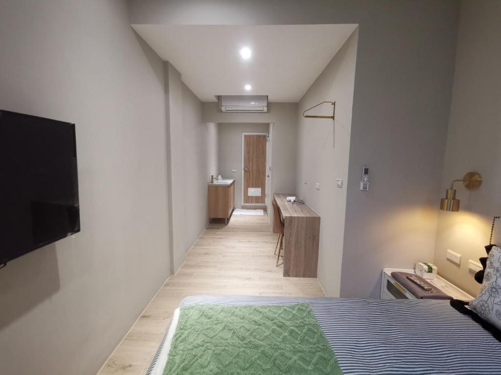 Postel nebo postele na pokoji v ubytování 橙舍一館 TW Hostel I