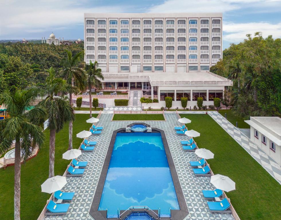an aerial view of the resort with a swimming pool and chairs at Tajview Agra-IHCL SeleQtions in Agra