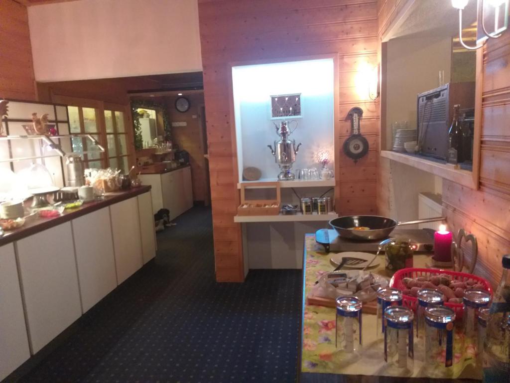 Kuchyň nebo kuchyňský kout v ubytování Hotel Klinger