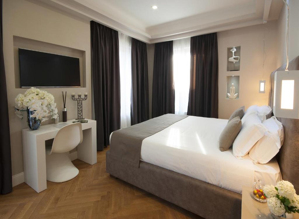 Łóżko lub łóżka w pokoju w obiekcie Terrazza Marco Antonio Luxury Suite