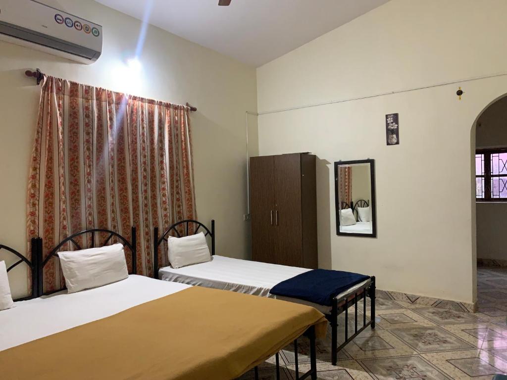 Postel nebo postele na pokoji v ubytování Casa De Calangute Hotel