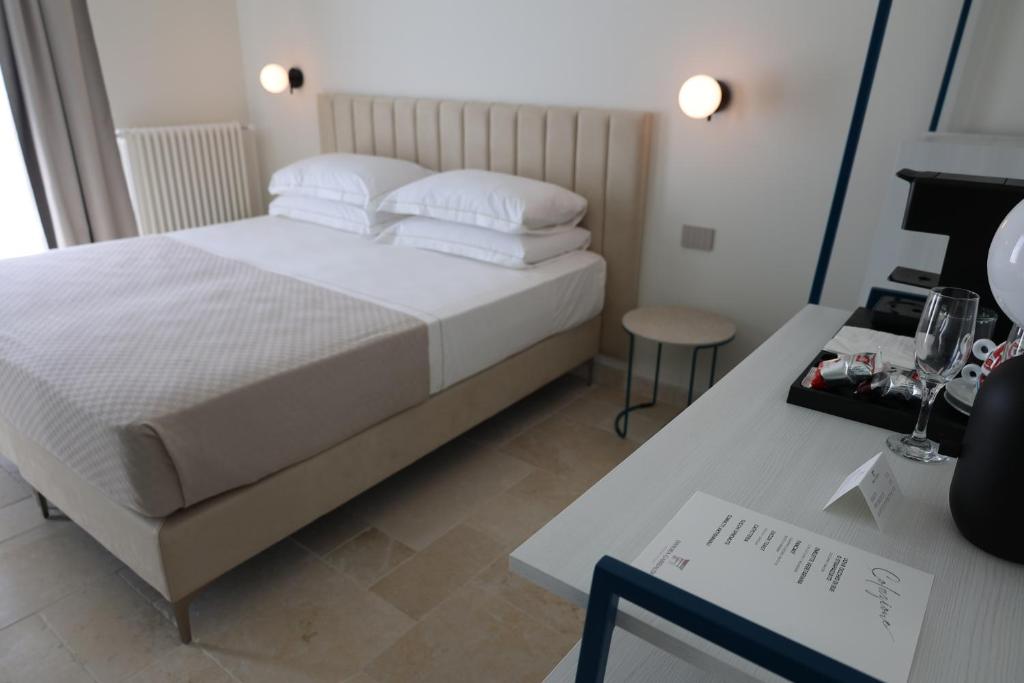 Postel nebo postele na pokoji v ubytování Suites Dimora Garibaldi