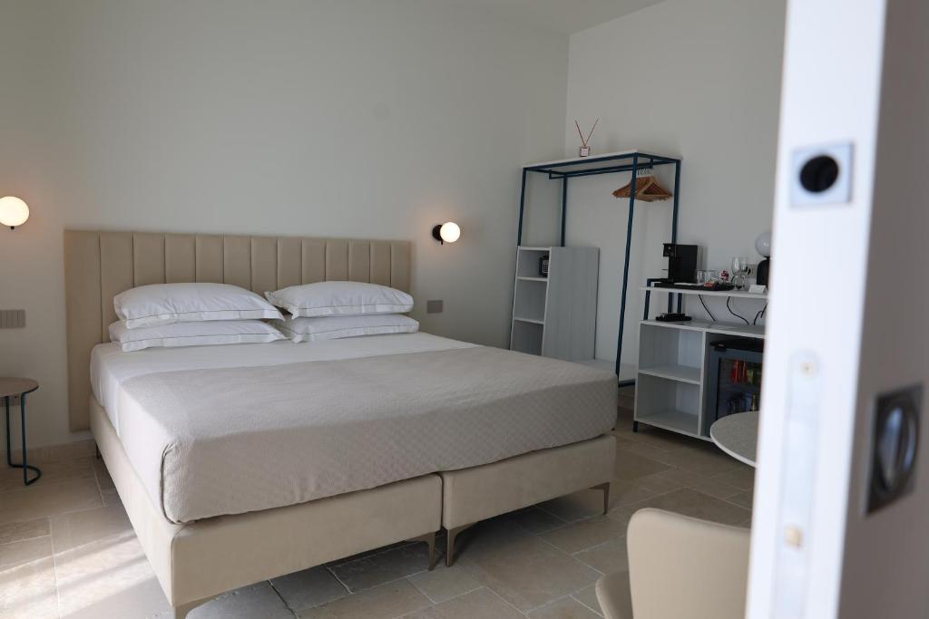 Postel nebo postele na pokoji v ubytování Suites Dimora Garibaldi