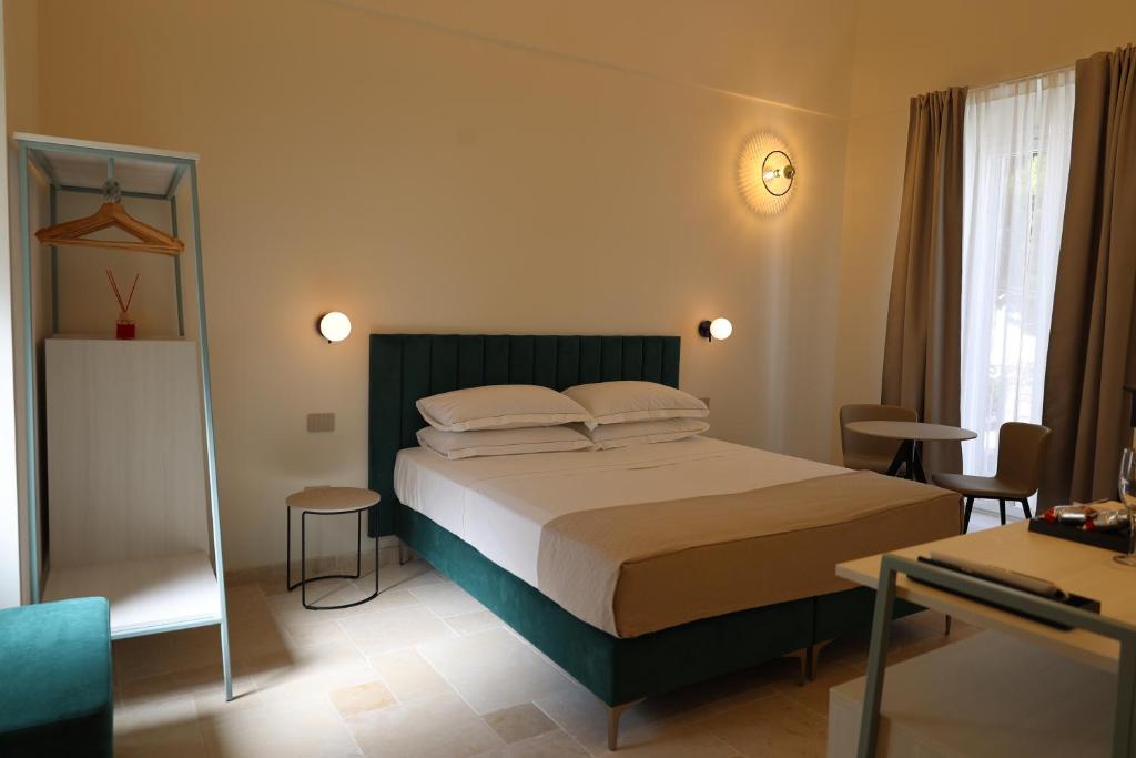 Postel nebo postele na pokoji v ubytování Suites Dimora Garibaldi