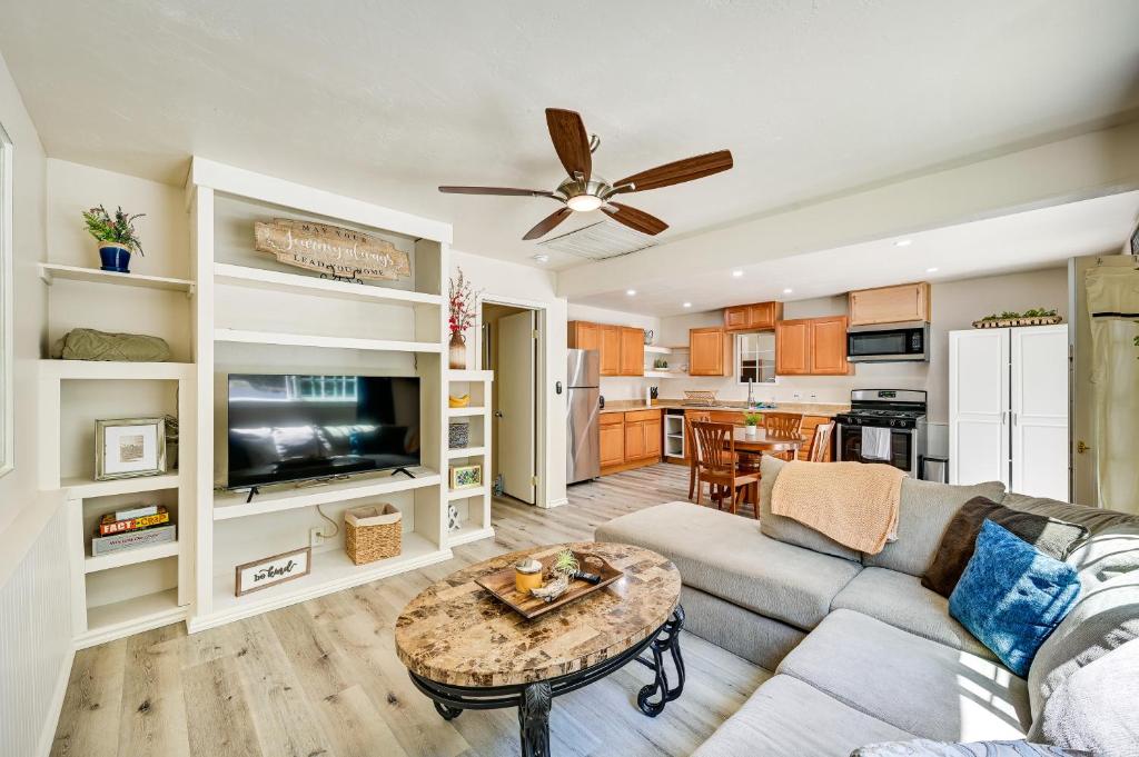 a living room with a couch and a table at Chic La Mesa Retreat with Patio and Charcoal Grill! in La Mesa