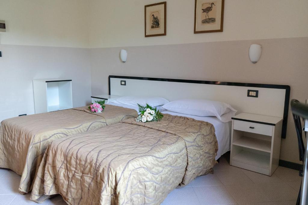 A bed or beds in a room at Hotel Italia