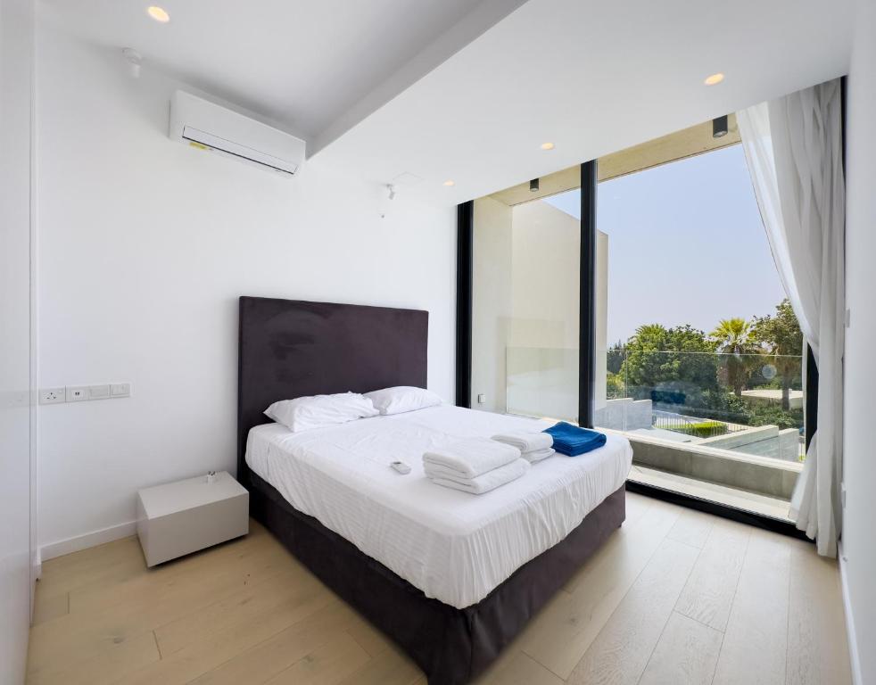 Postel nebo postele na pokoji v ubytování Sunset Park Villas