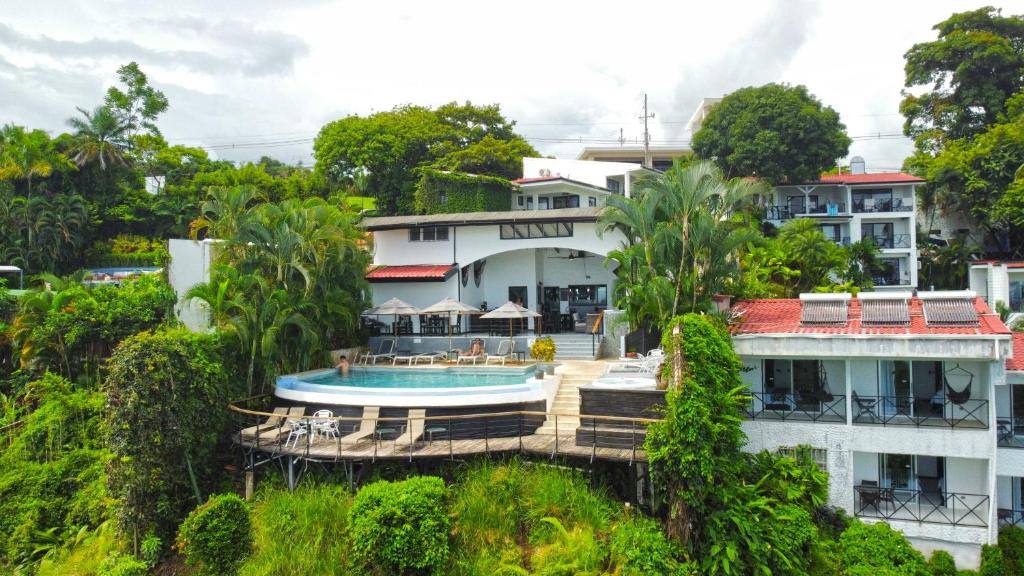 an aerial view of a house with a swimming pool at Villa Roca Boutique Resort & Suites - ADULT ONLY in Manuel Antonio