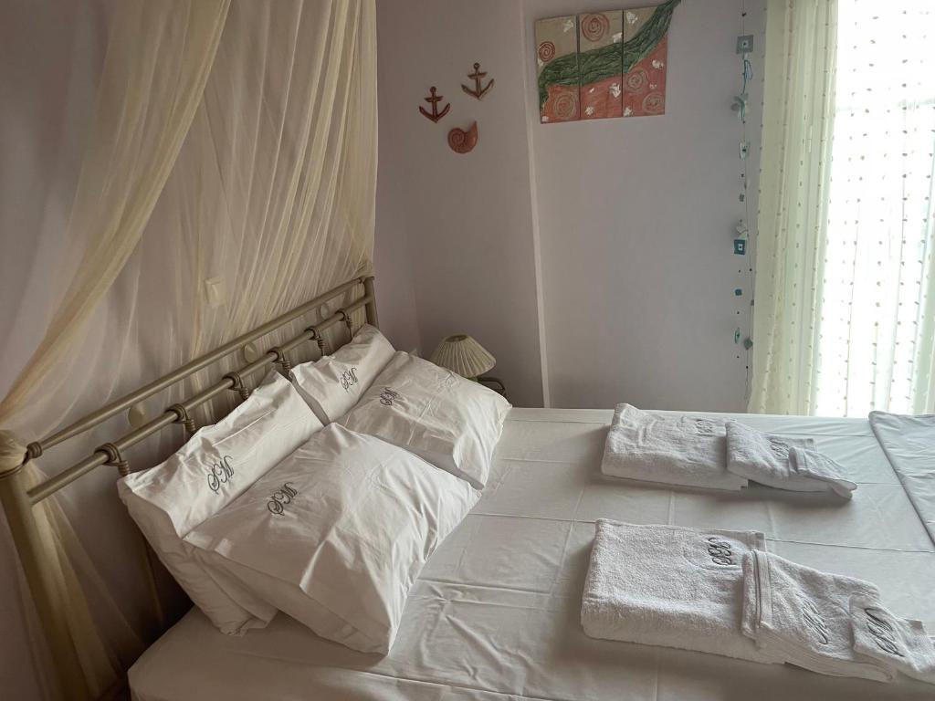 Voodi või voodid majutusasutuse Sea Urchin Apartment Neos Kosmos toas