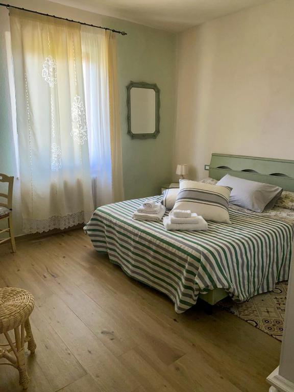 Postel nebo postele na pokoji v ubytování I Due Cipressi