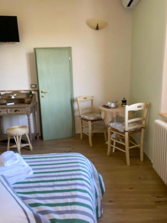 Postel nebo postele na pokoji v ubytování I Due Cipressi