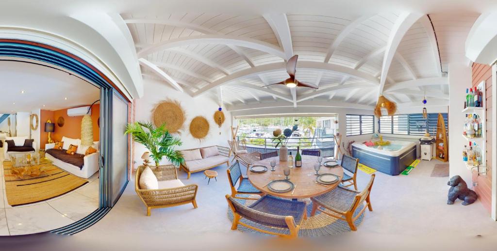 a living room with a table and chairs at MARINA, SPA & SUN - 2 bedrooms - LUXURY APARTMENT in Saint Martin