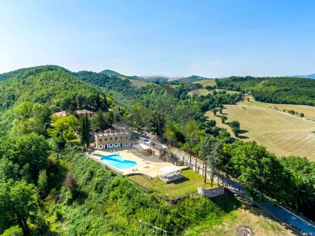 an aerial view of a house with a swimming pool at Majestic villa in Fermignano with private pool in Fermignano