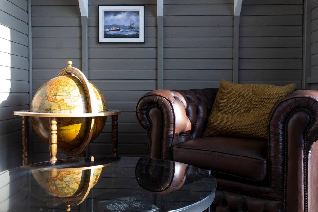 a living room with a couch and a table at Akureyri Retreat in Akureyri