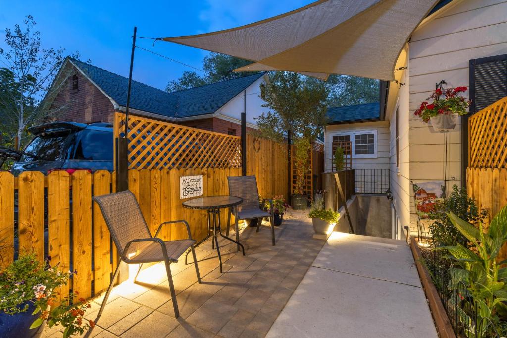 a patio with a table and chairs and a fence at Heart of Reno Studio about 1 Mi to Downtown! in Reno