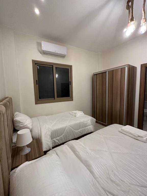 Postel nebo postele na pokoji v ubytování Jasmine flower hostel