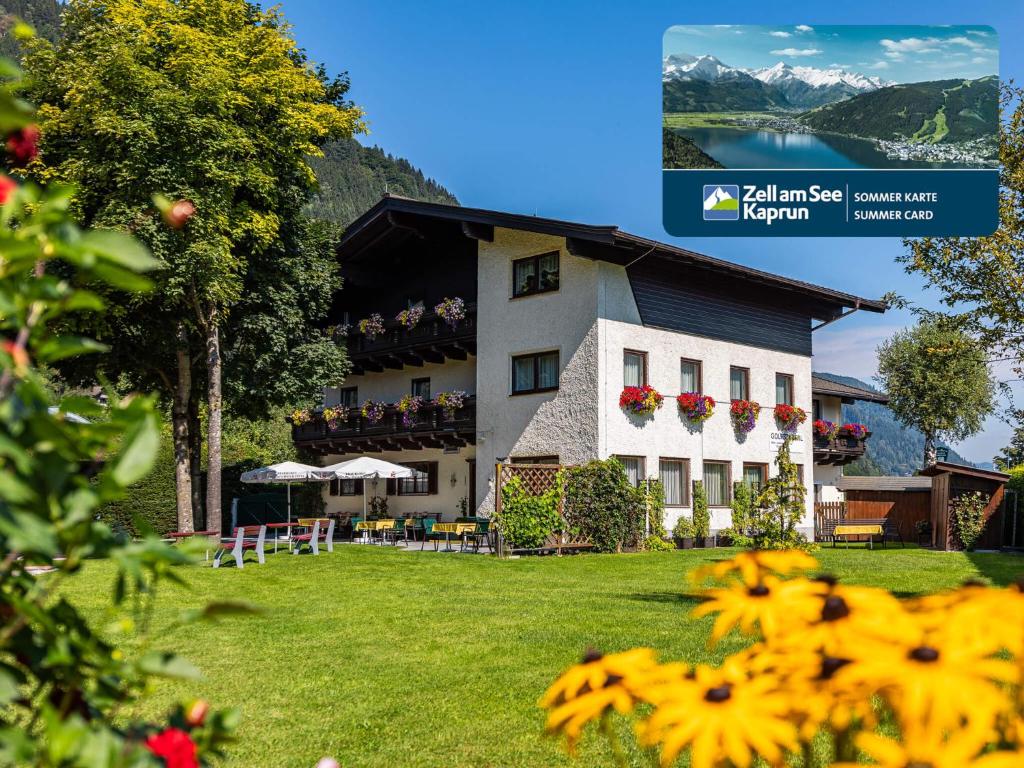 een hotel met uitzicht op het meer en de bergen bij Gästehaus Bleiweis-Zehentner in Zell am See