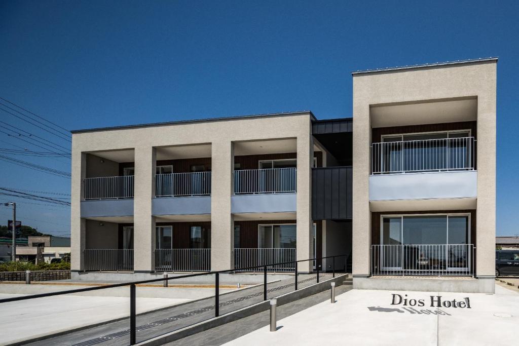 an apartment building with a blue sky in the background at Hotel Dios - Vacation STAY 31424v in Awaji