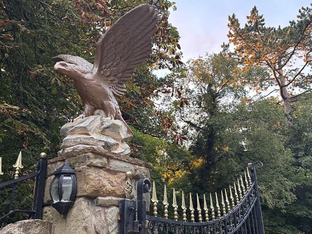 a statue of an eagle on top of a fence at Reemdale Manor - Fulwood Row Preston PR25RW in Grimsargh