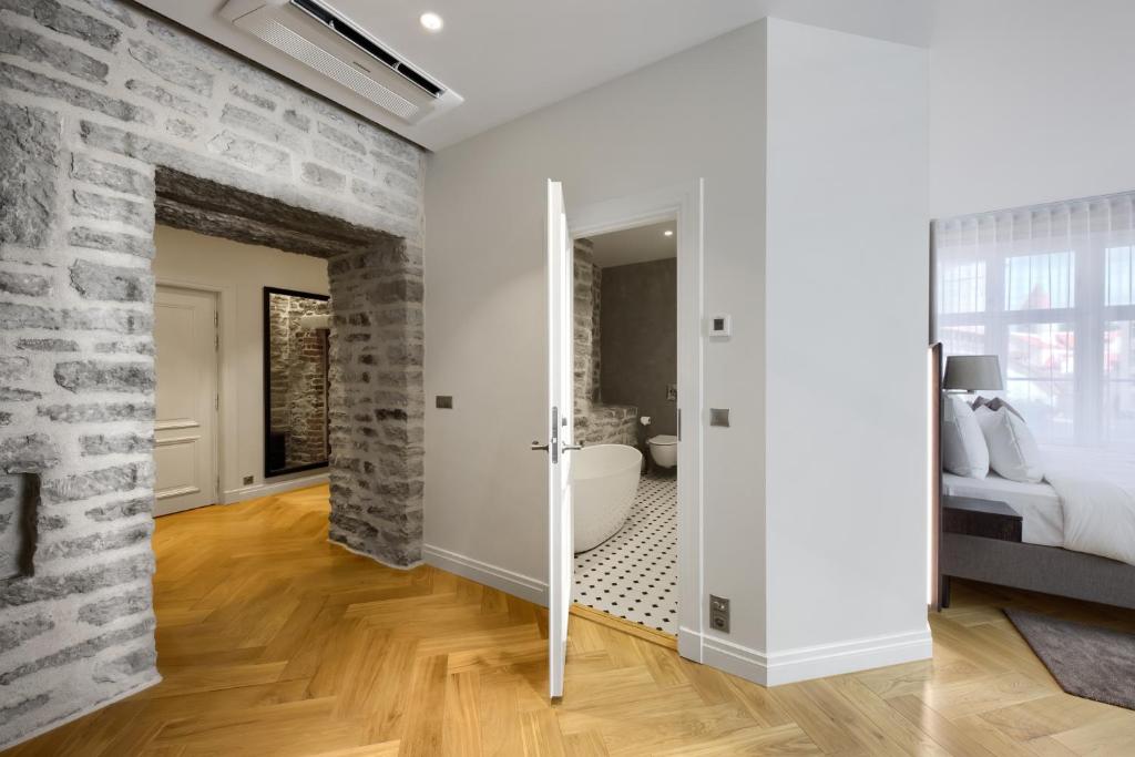 Postel nebo postele na pokoji v ubytování Nunne Boutique Hotel
