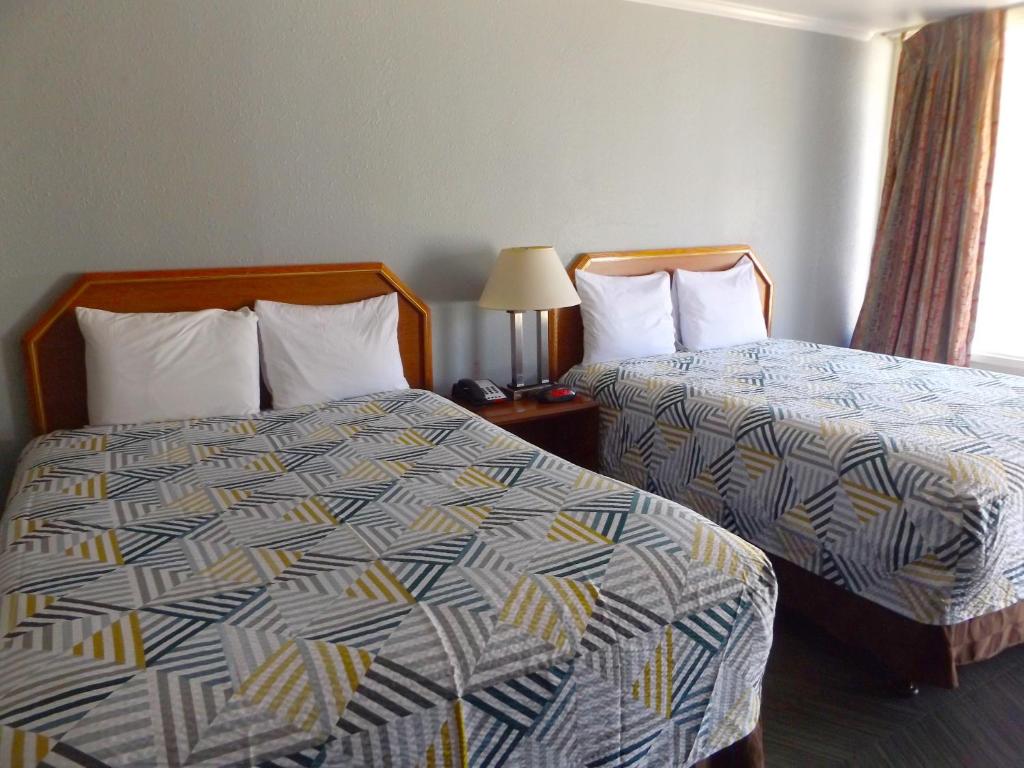 Ein Bett oder Betten in einem Zimmer der Unterkunft Fort Worth TX Downtown East