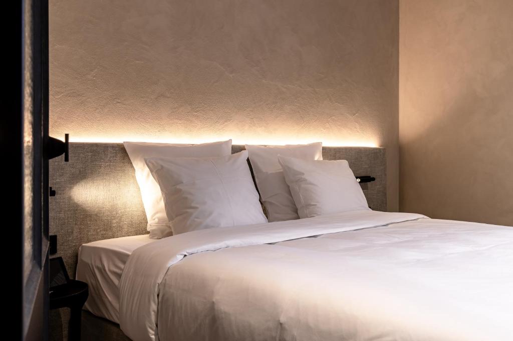 Postel nebo postele na pokoji v ubytování Hotel T