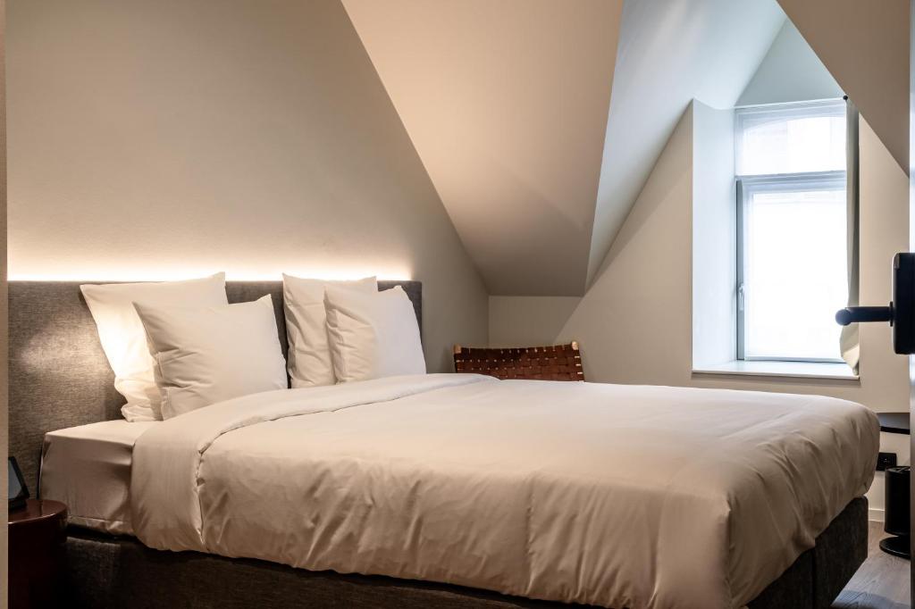 Postel nebo postele na pokoji v ubytování Hotel T